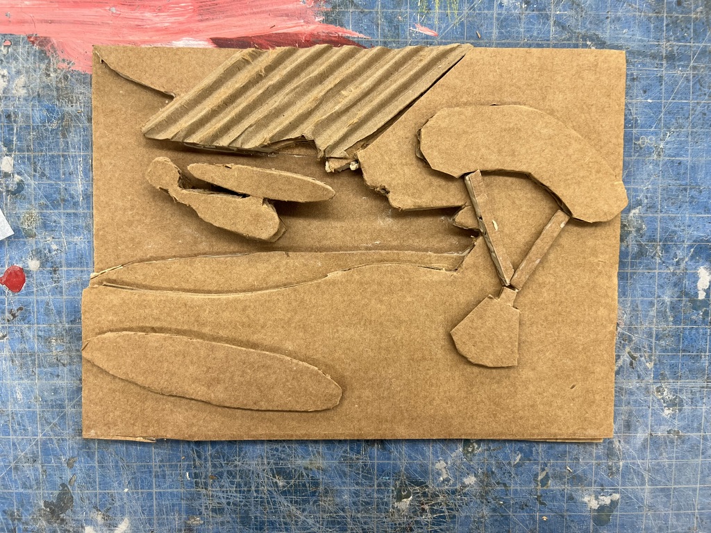 Layered cardboard prototype for Apollo-inspired aluminum casting relief